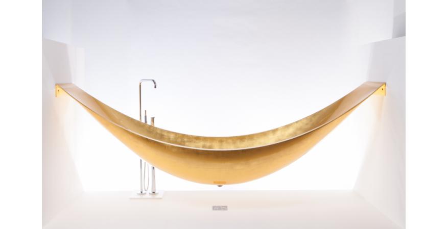Though striking as a freestanding model, Splinter Works’ Vessel is most compelling as a suspended hammock-style installation. Supported by stainless steel brackets at both ends, the tub comprises layers of carbon fiber and an insulating foam core and extends about 8 feet to 9 feet in length; custom sizes are available.