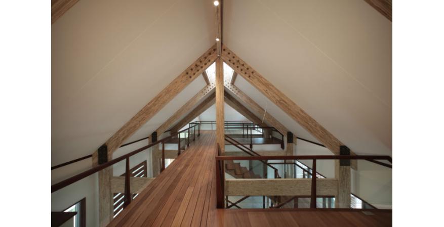 exposed engineered wood beams ceiling barn house interior
