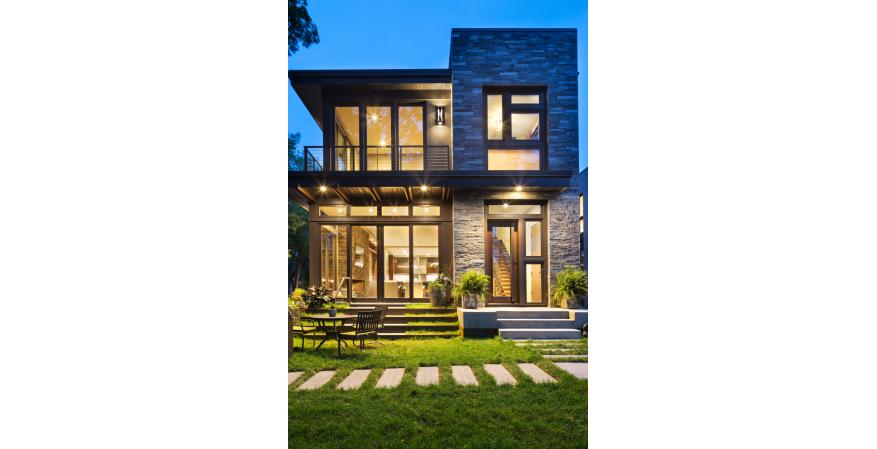 This modern residence offers a unique combination of privacy from adjacent homes. The home’s contemporary exterior features natural stone, corten steel, wood, and glass, all in perfect alignment with the site. The design goal was to take advantage of the views of Lake Calhoun by providing the homeowners with expansive walls of Integrity Wood-Ultrex Windows. With a small footprint and open design, stunning views are present in every room, making the stylish windows a huge focal point of the home.