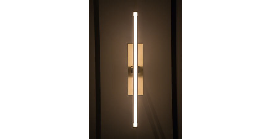 Douglas Fanning has released a new collection of wall-mounted brass light fixtures that pivot from vertical to horizontal.