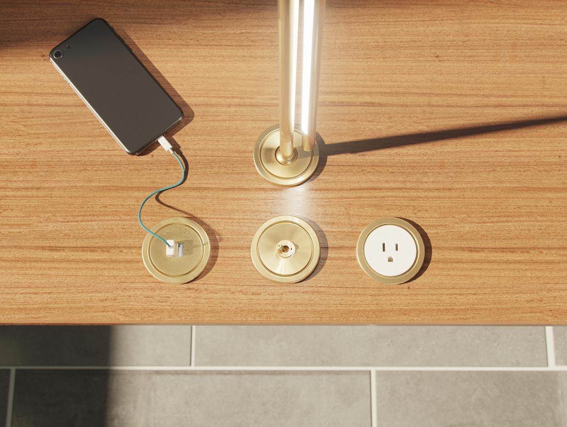 Lighting manufacturer Juniper Design Studio has introduced a line of brass surface-mounted electrical accessories that draws inspiration from the dials and switches of mid-century NASA mission control rooms.