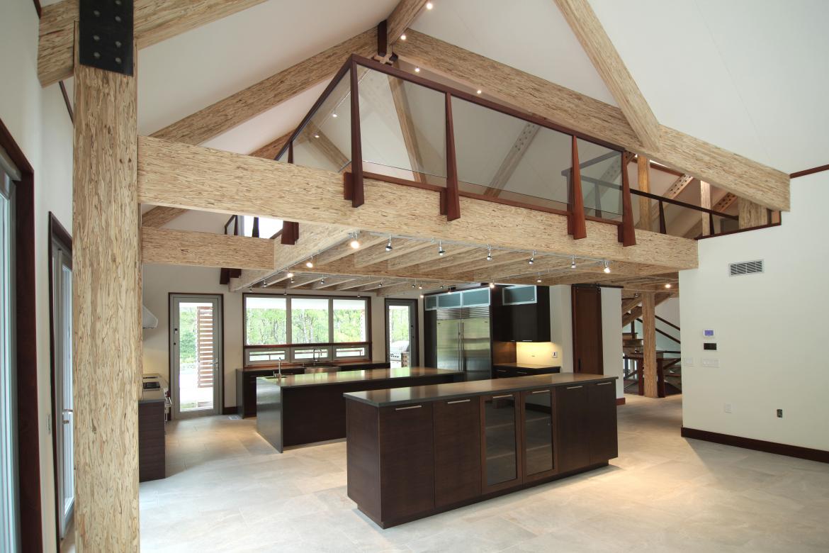 Exposed Engineered wood beams barn house interior
