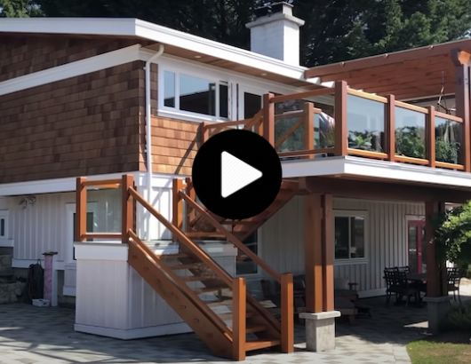 Jesse de Geest, founder of the Samurai Carpenter, renovated his old home with a new roof, cladding, and a second-story patio with a wooden-framed glass railing system.
