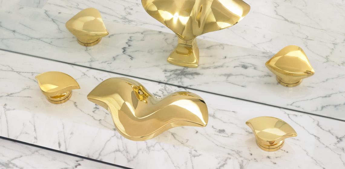 Gold-colored faucets from Alex Miller Studio