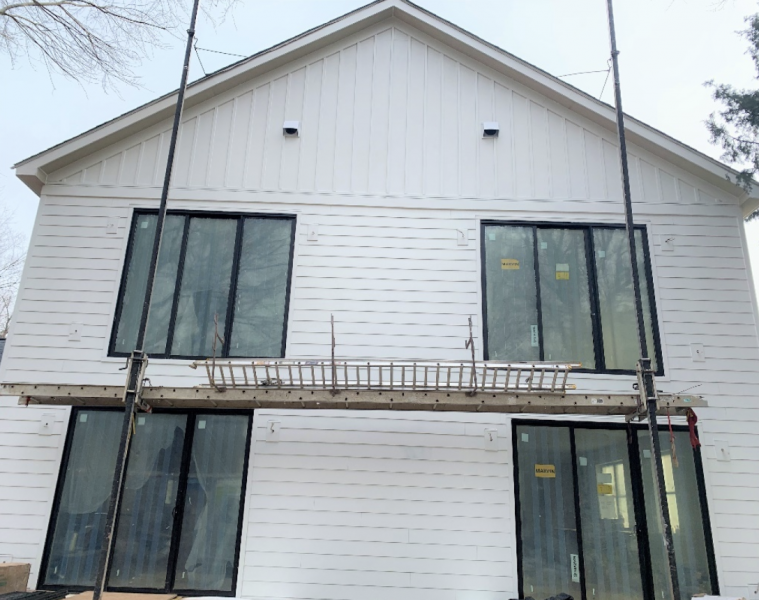 Rear view of SYMBI Duplex One featuring Allura’s lap siding, board-and-batten, trim and soffit fiber cement material