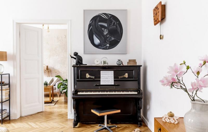 Piano in all-white room